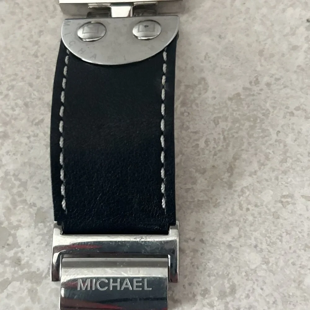 Michael Kors Women’s Rectangle Quartz Watch Silver Dial Black Leather Strap Date